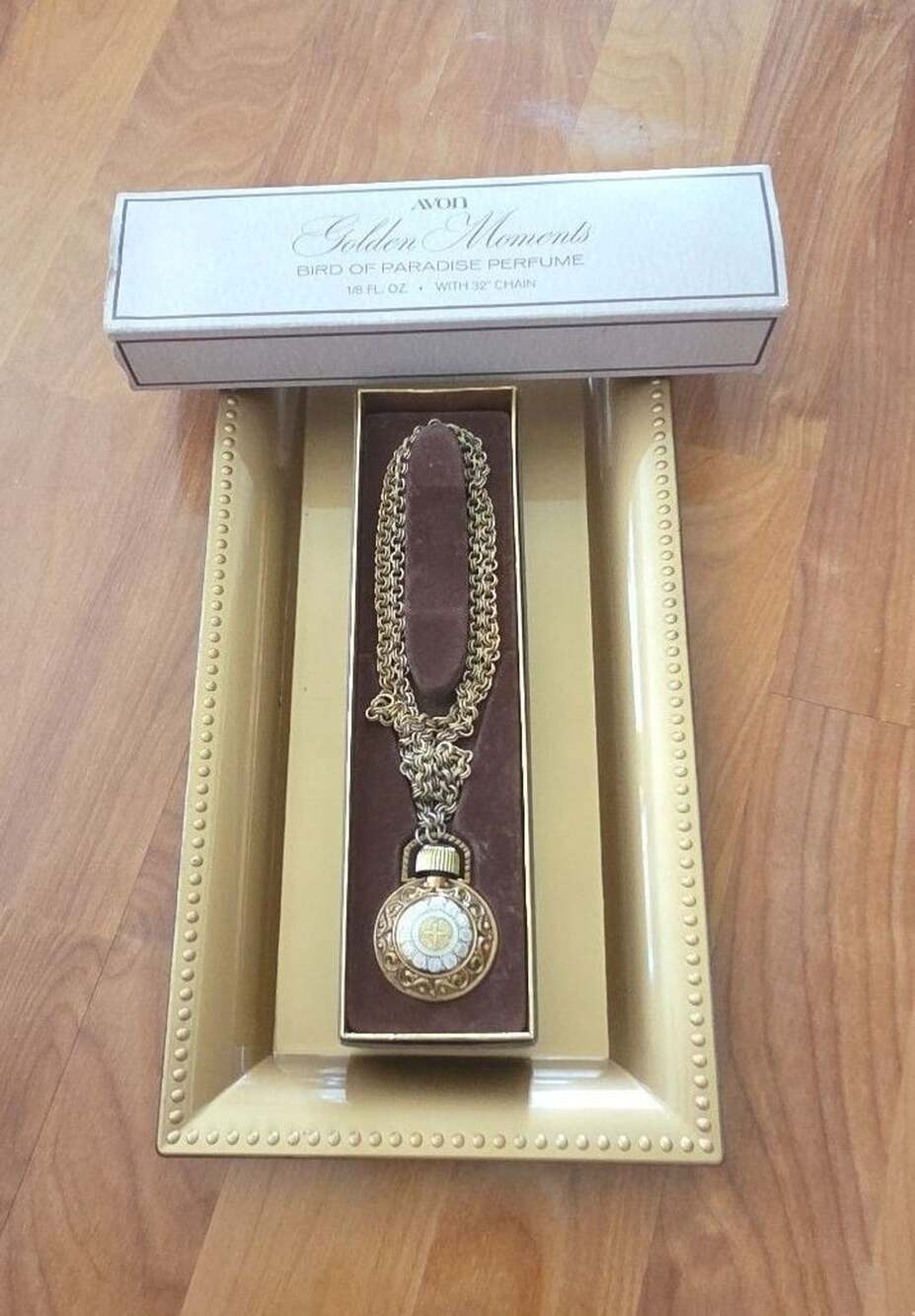 Avon Golden Moments Bird of Paradise Perfume Pendant with 32 Chain